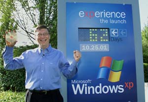 Bill Gates stood infront of a sign counting down the realse to windows XP, The countdown says 62 days.